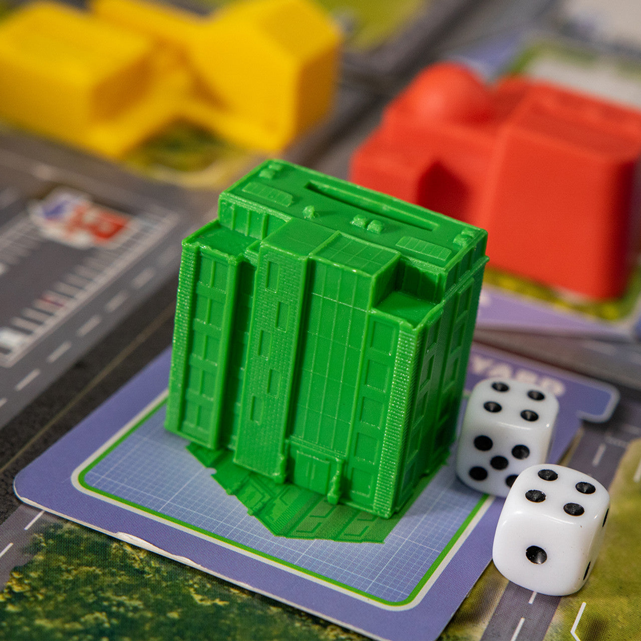 Magnate: The First City family economy builing game high rise miniature and dice